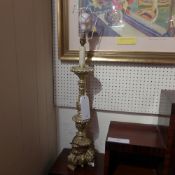 An early C20th carved giltwood and plast