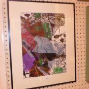 A glazed and framed lithograph by Jean-P