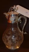 A silver plated claret jug with grapevin