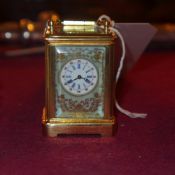 A Sevres style gilt metal miniature carr
