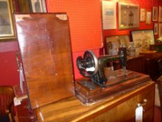 An old sewing machine within inlaid waln
