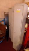 Three painted metal locker cabinets