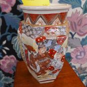A pair of Japanese Satsuma style vases decorated with picture reserves