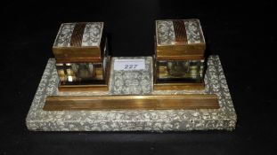 A desk set of C19th brass and cut glass double inkwells