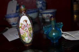 A Chinese blue glass snuff bottle together with an enamelled snuff bottle