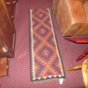 A Persian hand made Kelim runner having geometric patterns