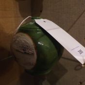 A Chinese green glazed lidded jar decorated with winter landscape reserves