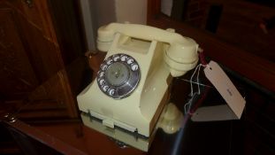 A vintage Bakelite ivory coloured telephone