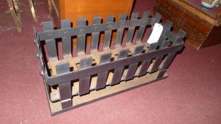 A large metal fire basket and ash box