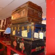 A group of three various vintage travelling trunks