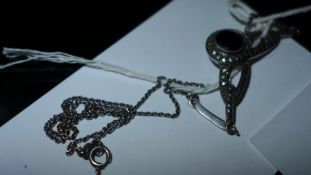An Art Deco silver and marquisite pendant necklace