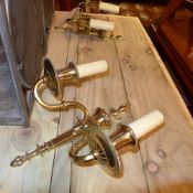 A pair of brass twin sconce wall lights