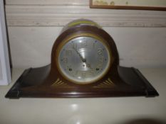 A 1930's oak cased mantel clock with steel dial and key and pendulum