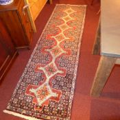 An extremely fine north west Persian Senneh runner, 255 x 75cm, repeating panel floral motifs