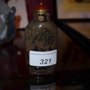 A Chinese inside painted snuff bottle decorated with landscape reserves