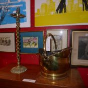A brass coal scuttle and a brass ashtray on twisted supports