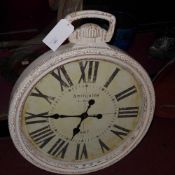 A painted distressed finish wall clock