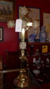 A brass crucifix of large size with plaques having the symbols of the four evangelists in relief