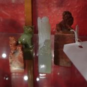 Two Chinese carved soapstone seals and three similar Chinese serpentine seals