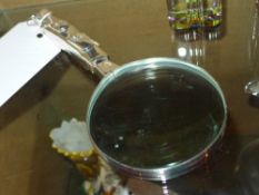 A silver plated magnifying glass with golf bag style handle