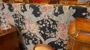 A Persian Bokhara style runner the red ground with repeating motifs within a triple border