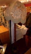 A stinkwood standard lamp with barley twist column and William Morris style shade