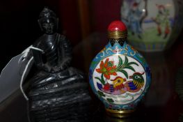 A Chinese cloisonne snuff bottle together with a carved Buddha figure