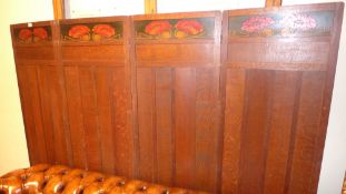 An oak four fold screen of panelled construction with carved and painted poppy head detail