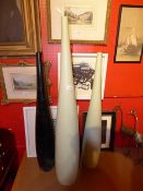 A set of three tall porcelain vases