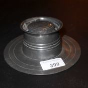 An Arts and Crafts pewter ship's inkwell