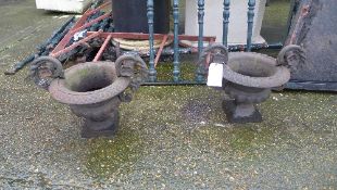 A pair of cast iron campana garden urns
