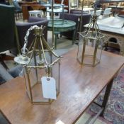 A pair of brass and glass hanging lanterns