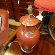A crackle glazed table lamp and a tolewa