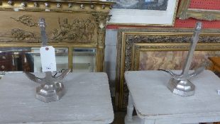 A pair of white metal anchor form table