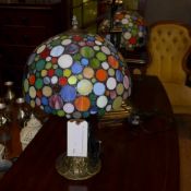 A pair of Tiffany style lamps with polka dot shades
