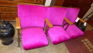 A set of three vintage cinema seats in p