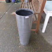 A pair of polished metal cylindrical pla