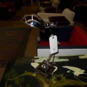 A pair of adjustable chromium desk lamps