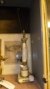 A white painted metal Corinthian form ta