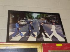 A framed print of the Beatles crossing A