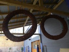 A pair of wicker wreaths