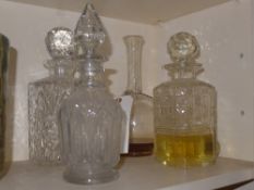 A collection of four decanters with two silver labels