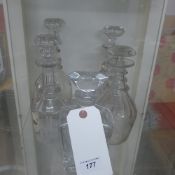 A collection of cut glass decanters and