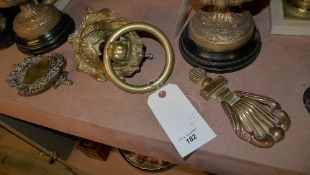 A collection of brass door knockers