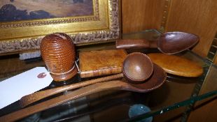 A collection of treen, ladles, money box