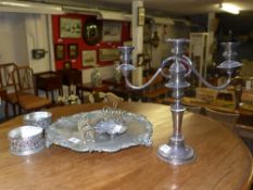 A collection of silver plate including candelabra, tray, coasters and others