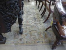 An Agra carpet the green ground with allover floral decoration W 250 L 310 cm