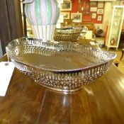 A pair of pierced plated bread/fruit dis