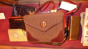 A collection of designer handbags [7]