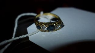 A 18ct gold ladies ring inset with sapphires and diamonds